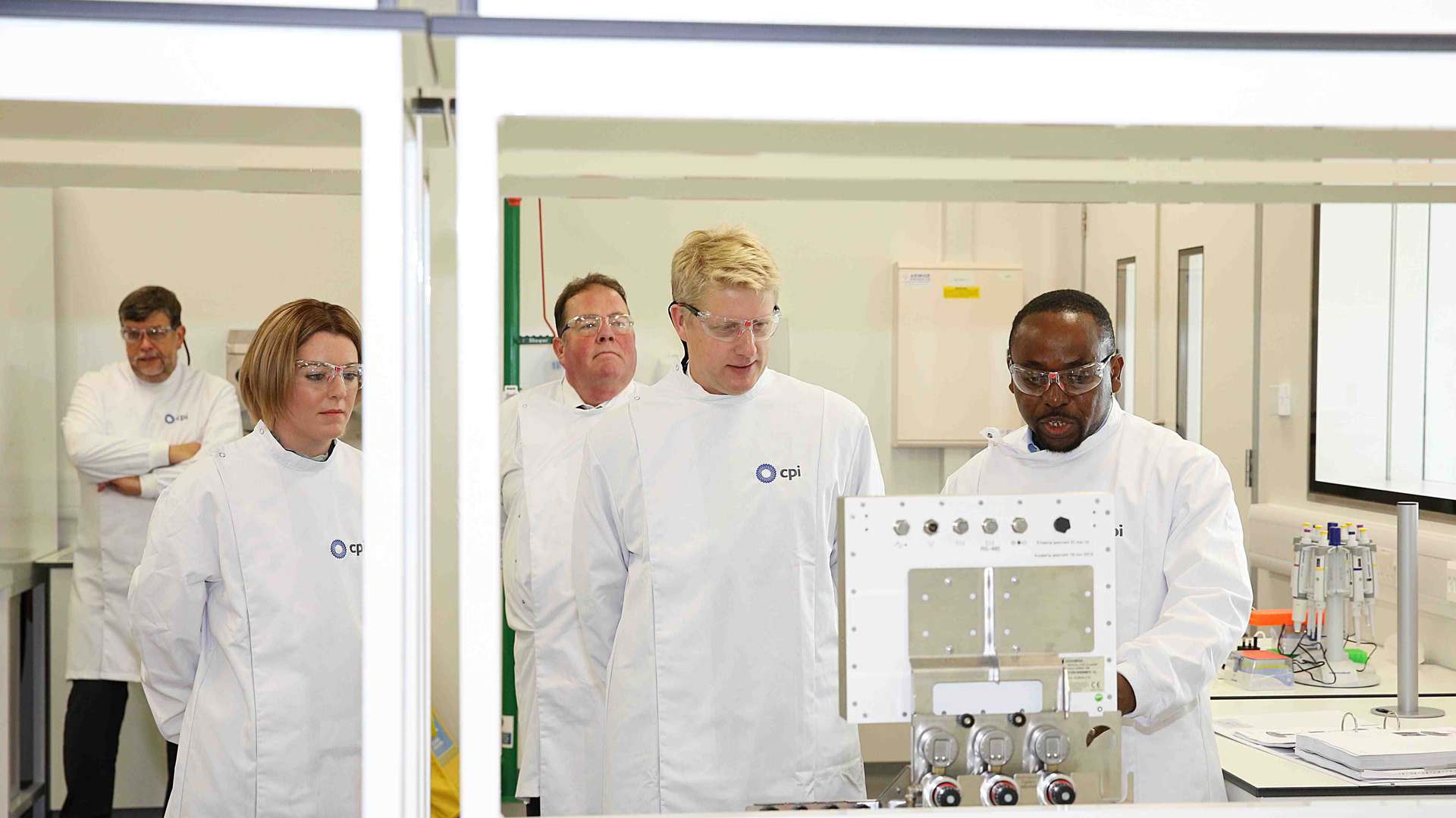 Photo of Jo Johnson getting a tour of the labs at the National Biologics Manufacturing Centre Photo of Jo Johnson getting a tour of the labs at the National Biologics Manufacturing Centre