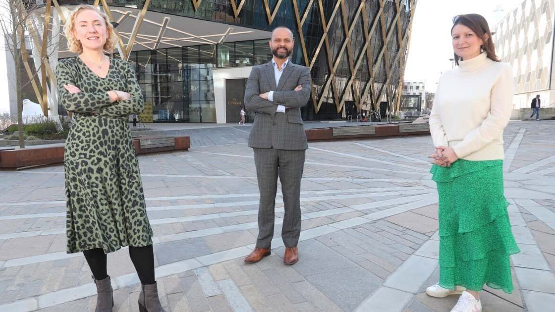 A photo showing three people (Arun Harish, Sophie Walton and Jen Hartley) stood in front of a glass building (The Catalyst building at Newcastle Helix) A photo showing three people (Arun Harish, Sophie Walton and Jen Hartley) stood in front of a glass building (The Catalyst building at Newcastle Helix)