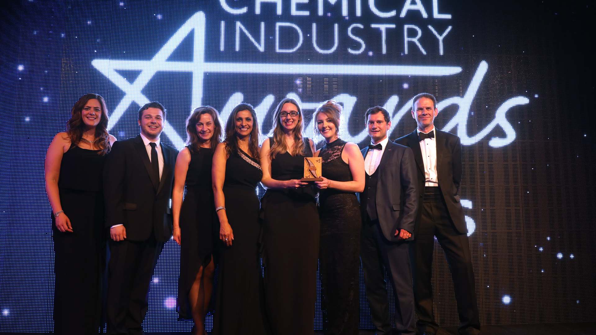 CPI's Hayley Carter, Ben Gay, Andrea Parr, Louise Barker, Sarah Scarr, Matthew Abbott and Frank Millar collect the Chemical Industry Service Provider of the Year Award from host Sameena Ali-Khan, fourth from left CPI's Hayley Carter, Ben Gay, Andrea Parr, Louise Barker, Sarah Scarr, Matthew Abbott and Frank Millar collect the Chemical Industry Service Provider of the Year Award from host Sameena Ali-Khan, fourth from left