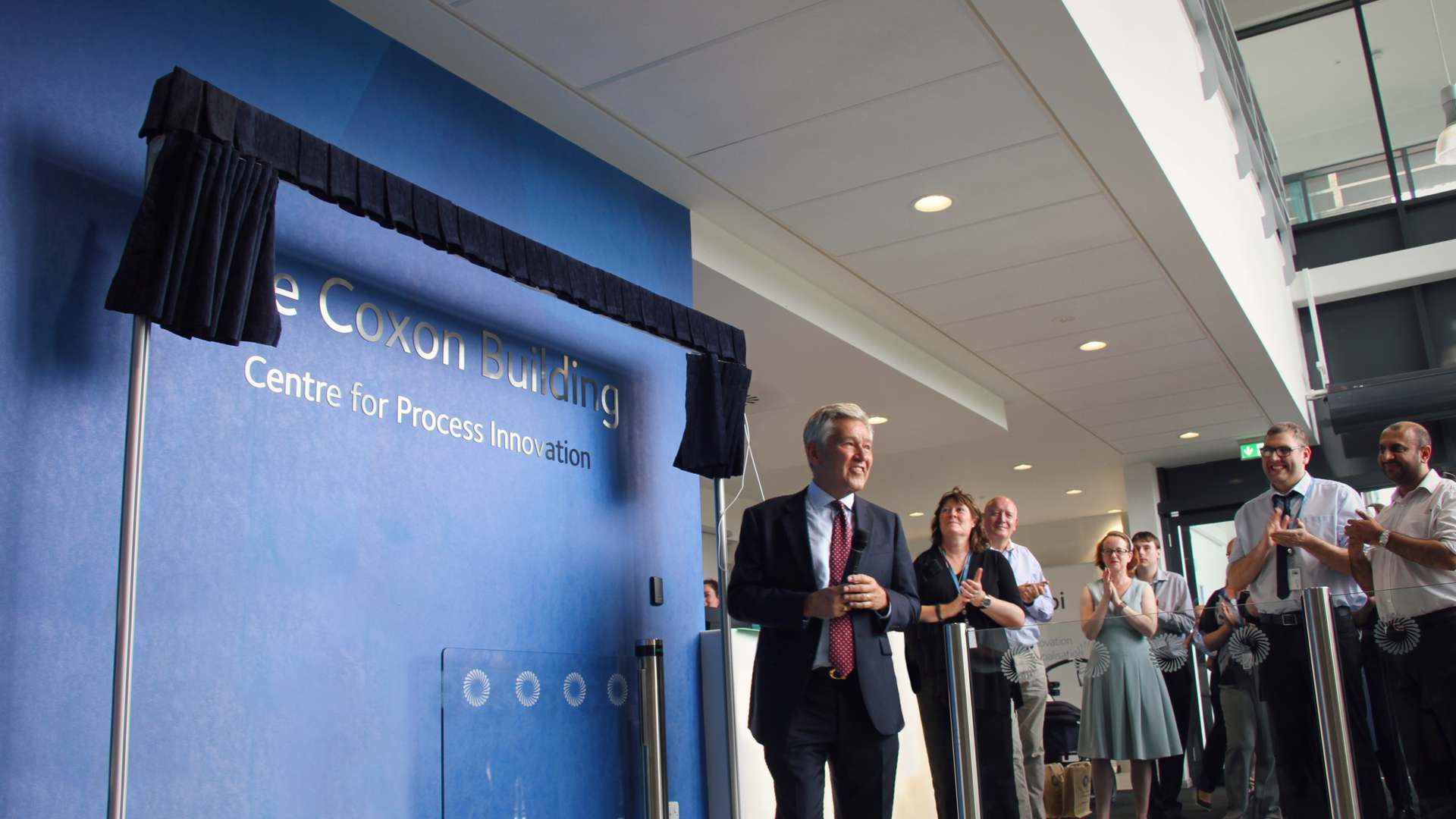 Bob Coxon unveils the wall plaque during CPI's naming ceremony Bob Coxon unveils the wall plaque during CPI's naming ceremony
