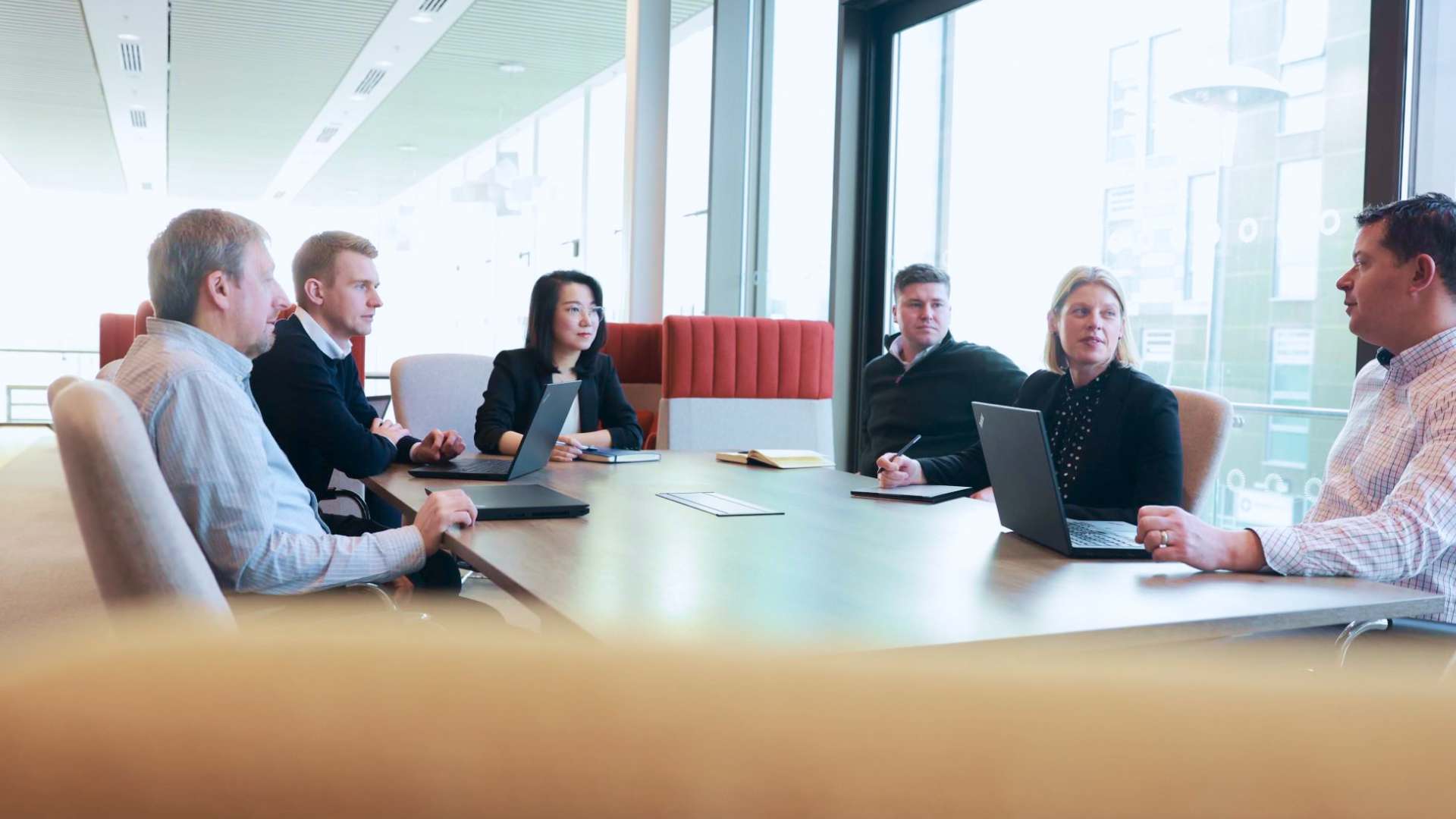 Our CPI Enterprises team sat round a table in discussion Our CPI Enterprises team sat round a table in discussion