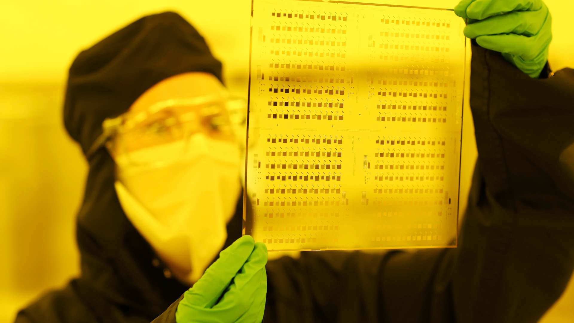 A photo a CPI staff member holding up a substrate with printed sensors embedded into it A photo a CPI staff member holding up a substrate with printed sensors embedded into it