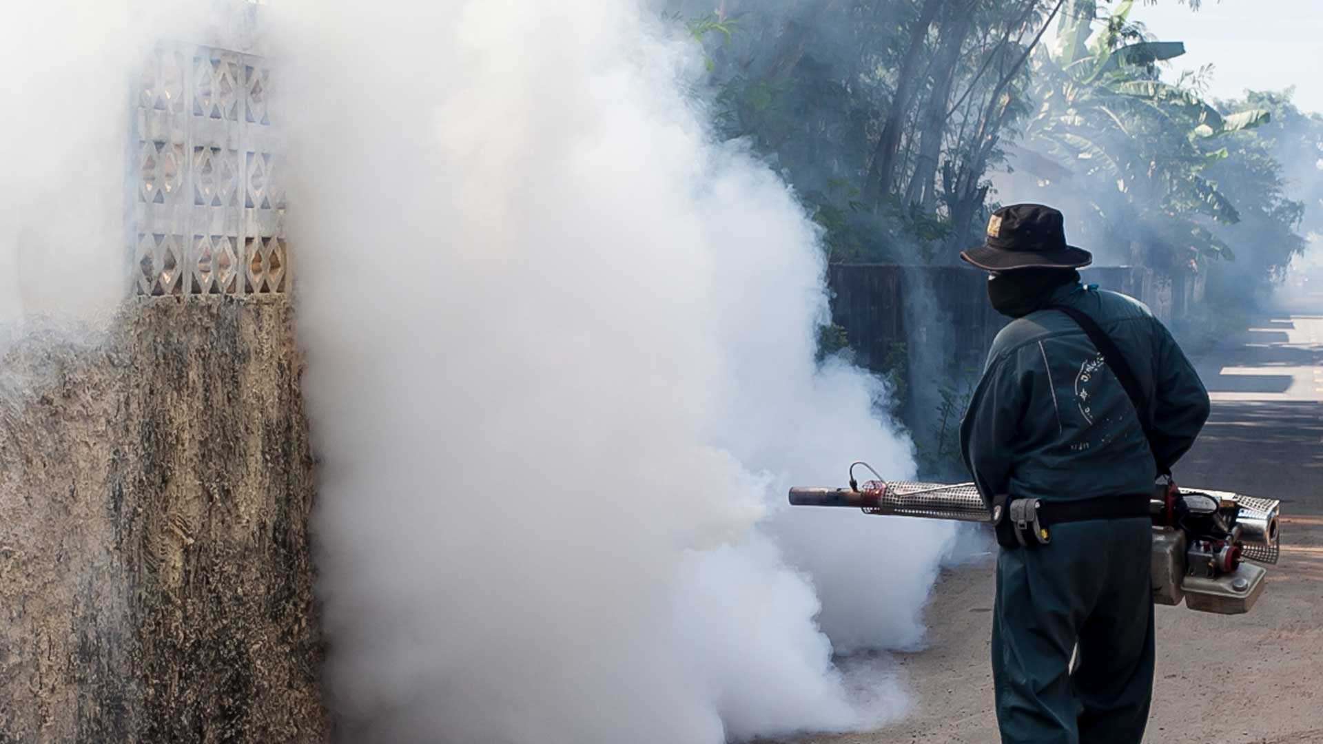 A man fogs mosquitoes to prevent the spread of the Zika virus A man fogs mosquitoes to prevent the spread of the Zika virus