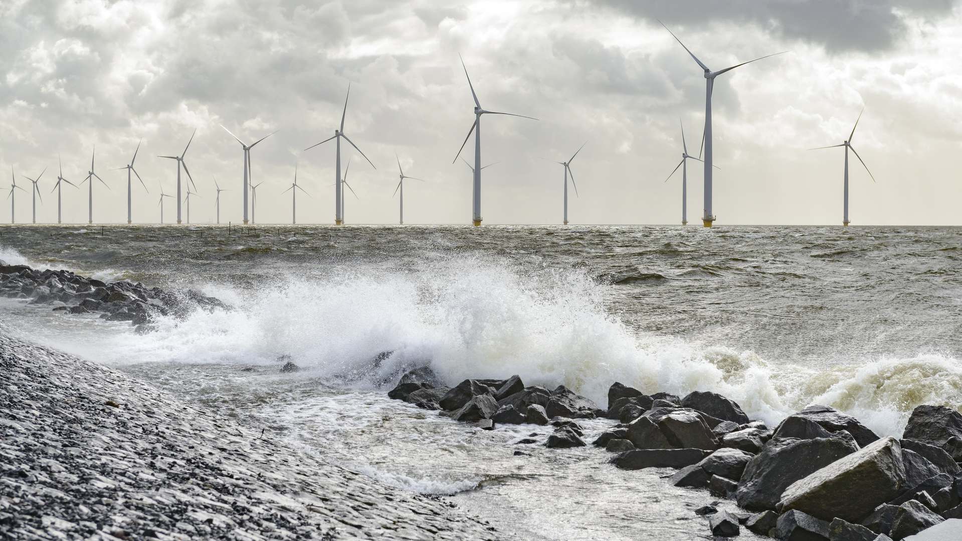 A photo of wind turbines in the sea A photo of wind turbines in the sea
